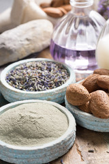 Nature cosmetics, handmade preparation with essential oils and ancient minerals of  perfume, creams, soaps from fresh and dried lavender flowers, wheat, almond nuts, green clay powder 