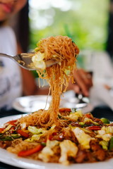 Tasty stir fry rice noodle with meat and vegetables, Asian food celebration