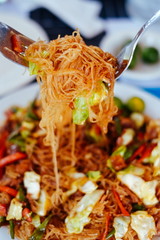 Tasty stir fry rice noodle with meat and vegetables, Asian food celebration