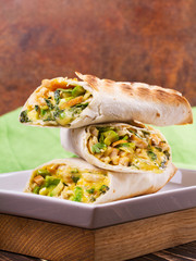 Chicken, avocado, cilantro and cheese burritos