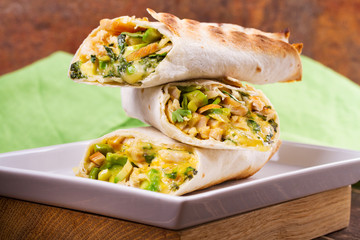 Chicken, avocado, cilantro and cheese burritos