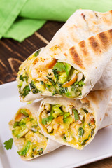 Chicken, avocado, cilantro and cheese burritos