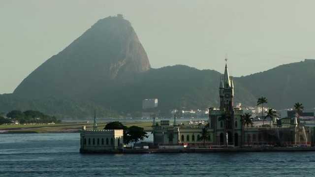 Ilha Fiscal in Rio de Janeiro as seen from a ship arriving in the main port. Sugar Loaf can be seen in the background