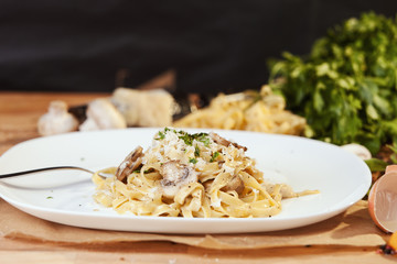 Pasta tagliatelle with mushrooms and parmesan. 