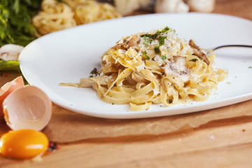 Pasta tagliatelle with mushrooms and parmesan. 