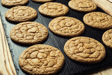 Biscuit sweet cookie background. Domestic stacked butter biscuit pattern concept,close up macro.Homemade cookies on wooden table.Cereal biscuits with the sesame,peanuts,sunflower and amaranth.