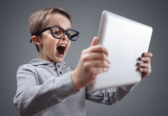 Shocked and surprised boy on the internet with laptop computer