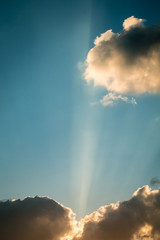 Sun rays breaking through the clouds