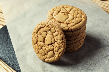 Biscuit sweet cookie background. Domestic stacked butter biscuit pattern concept,close up macro.Homemade cookies on wooden table.Cereal biscuits with the sesame,peanuts,sunflower and amaranth.