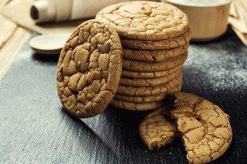 Biscuit sweet cookie background. Domestic stacked butter biscuit pattern concept,close up macro.Homemade cookies on wooden table.Cereal biscuits with the sesame,peanuts,sunflower and amaranth.