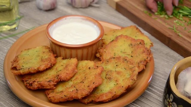Potato pancakes fry and serving, stock footage