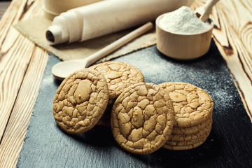 Biscuit sweet cookie background. Domestic stacked butter biscuit pattern concept,close up macro.Homemade cookies on wooden table.Cereal biscuits with the sesame,peanuts,sunflower and amaranth.