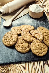 Biscuit sweet cookie background. Domestic stacked butter biscuit pattern concept,close up macro.Homemade cookies on wooden table.Cereal biscuits with the sesame,peanuts,sunflower and amaranth.