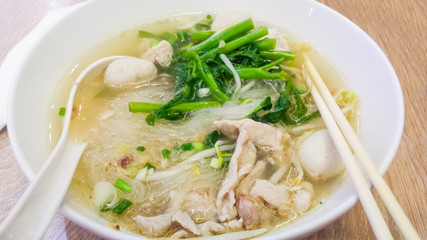 Thai food noodles with beef stew soup in a bowl.