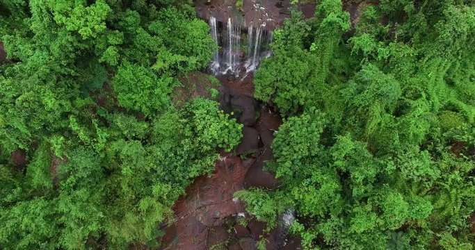 4K aerial view of waterfall in THAILAND. Nakhonphanom. Shooting from the drone fly over the rain forest and natural stream from waterfall