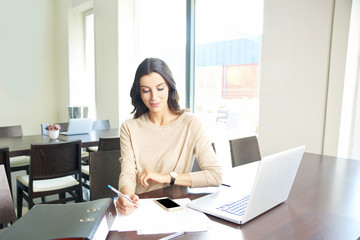 Financial consultant professional woman working on laptop at office