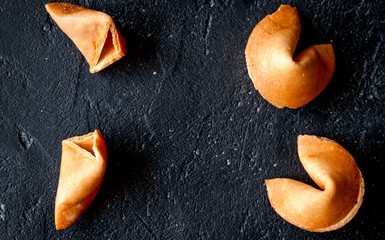 Chinese fortune cookie with prediction on dark background top vi