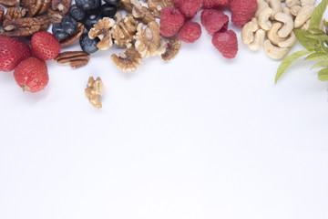 Background image of a healthy breakfast including a variety of fruit and nuts with copy space