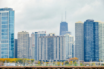 Fototapeta premium Chicago skyscrapers, Illinois state city, famous for the fountain and the magical colors of autumn, in the city park