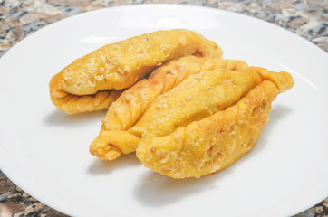 Typical food called Saltenha de Carne in Brazil. Salty, fried, stuffed with meat and spicy sauce. Common in regions of Brazil with Bolivian influence.