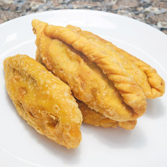 Typical food called Saltenha de Carne in Brazil. Salty, fried, stuffed with meat and spicy sauce. Common in regions of Brazil with Bolivian influence.