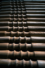 Wooden fragment ornament for shisha decoration on a wooden background.