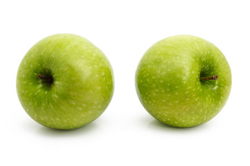 Two green apples isolated on white background