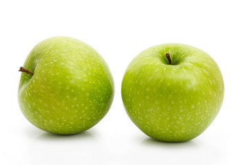 Two green apples isolated on white background