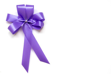 Blue bow as award ribbon on white background