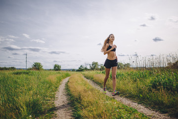 A young girl jogging outdoor