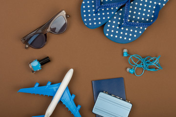 Adventure time - plane, flip flops, passport, little suitcase, sunglasses, nail polish