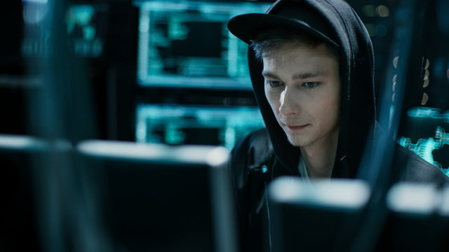 Hooded Teenage Hacker Successfully Attacks Global Infrastructure Servers with Virus.
