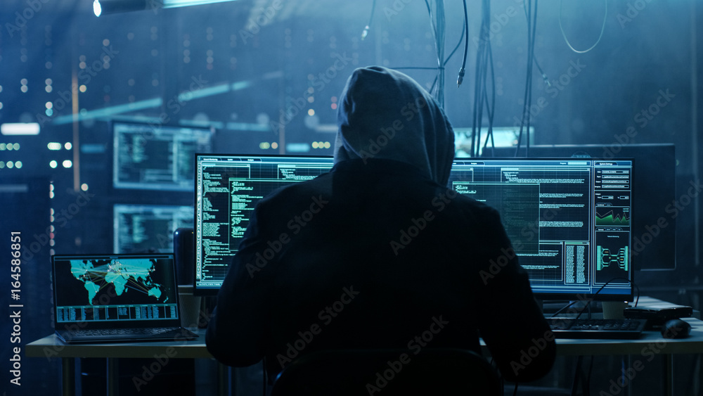 Poster Dangerous Hooded Hacker Breaks into Government Data Servers and Infects Their System with a  Virus. His Hideout Place has Dark Atmosphere, Multiple Displays, Cables Everywhere.