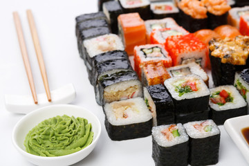 Set of sushi and rolls on white background, pov view