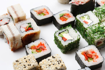Set of sushi, maki and rolls on white background