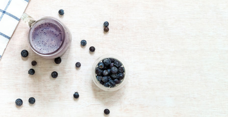 Blueberry smoothie with fresh blueberries from above