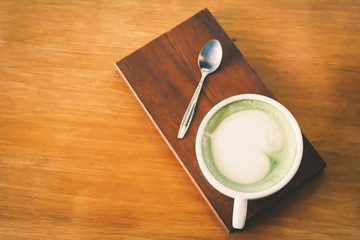 Green tea cup in cafe shop time to relax ,hipster tone and soft of focus