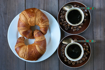 romantic morning breakfast two shots of espresso and two croissants