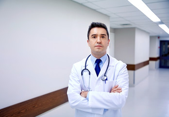 doctor with stethoscope at hospital corridor