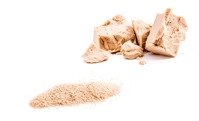 fresh and dried yeast on white background