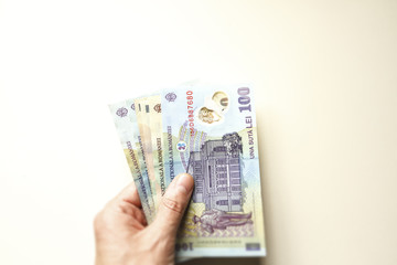 Man hand with romanian money lei
