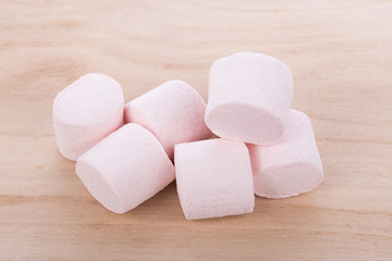 marshmallows on wooden background