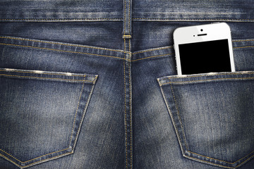 Denim Jeans texture background with white smartphone in the pocket