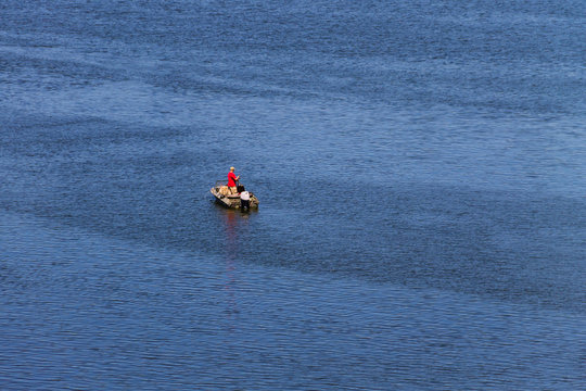 Boat with fishermen at the river Dnieper, Ukraine