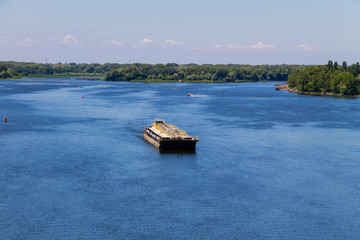Fototapeta na wymiar Barge floating on the Dnieper river