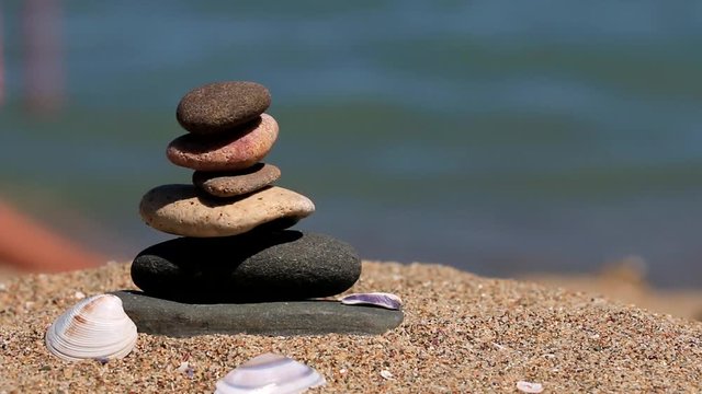 zen stone tower on the beach close-up