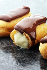 Traditional French dessert. Eclair with chocolate icing. Pastery