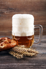 Beer in a mug. Oktoberfest salted soft pretzels and beer from Ge