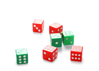 Red and green gambling dice isolated on white background