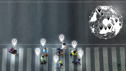 concept art of person icon with world social network connecting of the busy city crowd move to pedestrian crosswalk on business traffic road (Aerial photo, top view)